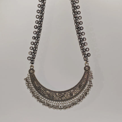 Crescent Bib Choker Necklace in Oxidised German Silver – Floral Engraving and Ghungroo Drops