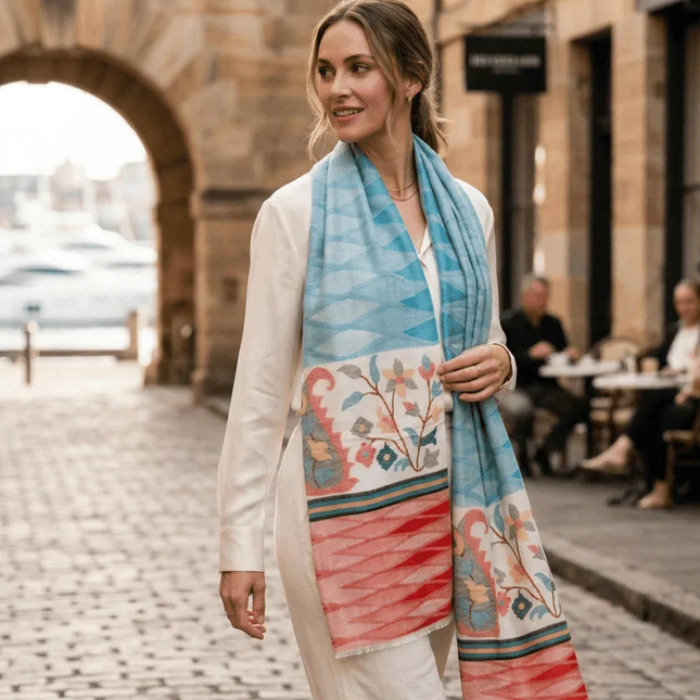 Woman wearing a colorful scarf in an urban setting