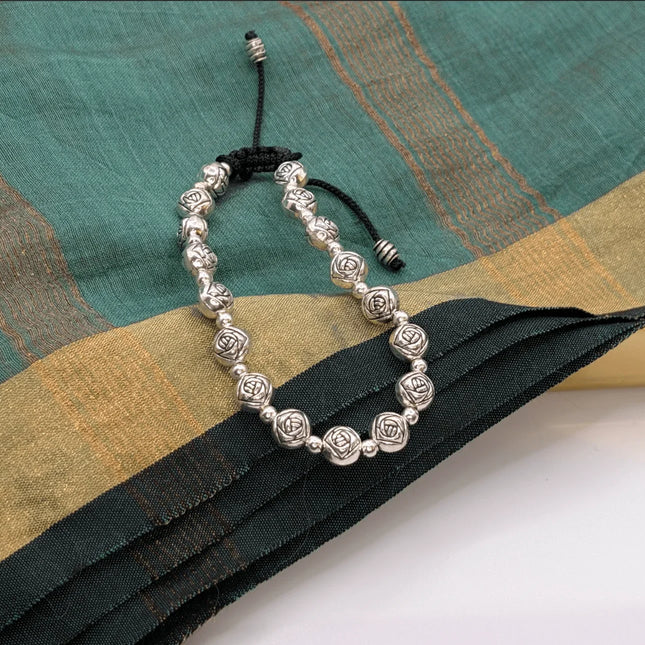 Delicate Bracelet with Flower Motifs on Beads in German Silver - Handmade Indian Artisanal - The Ganges Store